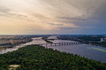 Fototapeta na wymiar Panoramic view of Kiev city with the Dnieper River in the middle. Aerial view