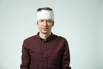 Man with bandage on his head