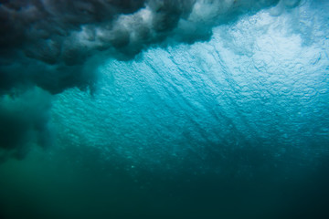 Wave in underwater, blue clear ocean