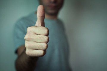 Man showing a thumbs up sign.