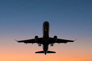 Fototapeta premium airplane on sunset sky , aircraft silhouette scenic sky