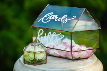 stylish decorated glass box for wedding greetings and cards and gifts at the reception in a restaurant