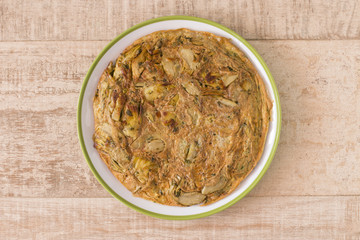 Round artichokes omelet and some eggshells.