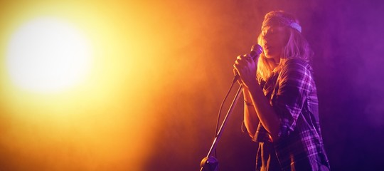 Singer performing at concert 