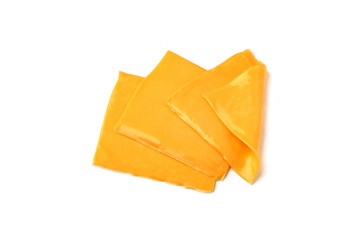 Cheddar cheese slices on a white background