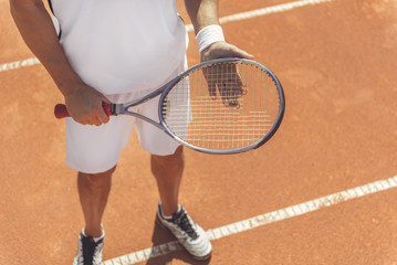 Sportsman keeping special necessary racket