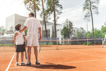 Family going to play tennis