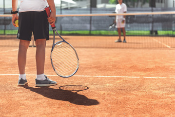 Young male child ready for tennis