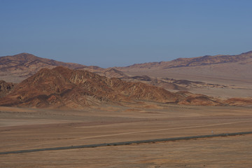 Pan American Highway (Ruta 5) running through the harsh and arid landscape of the Atacama in northern Chile.