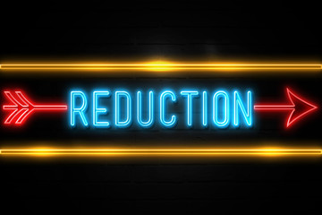 Reduction  - fluorescent Neon Sign on brickwall Front view