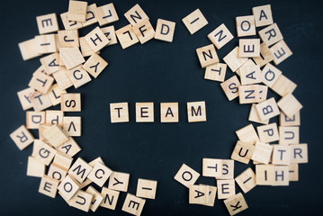 The letters on the black background form the text "team"