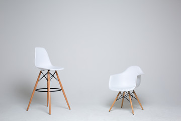 Two stylish modern white chairs