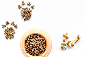 dry pet - dog food in bowl on white background top view mock up
