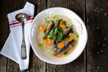 Rice soup with sprats, carrots with leek and parsley.