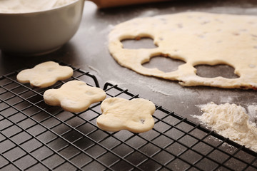 Raw cookies on baking grid, closeup