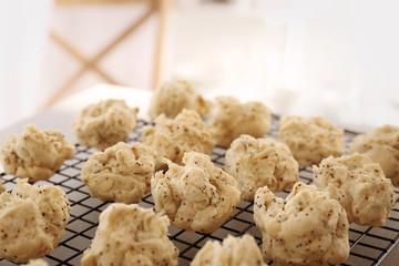 Raw dough for cookies on baking grid, closeup
