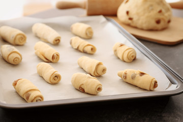 Raw pastry on baking tray, closeup