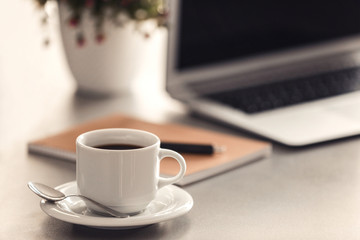 Cup of coffee on office table,