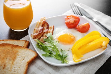 Tasty breakfast with egg on plate