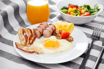 Tasty breakfast with egg on plate