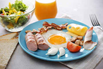 Tasty breakfast with egg on plate