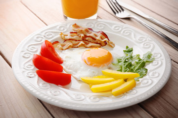 Tasty breakfast with egg on plate