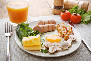 Tasty breakfast with egg on plate