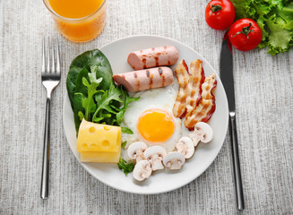 Tasty breakfast with egg on plate