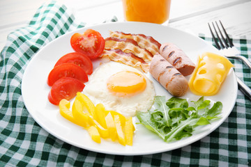 Tasty breakfast with egg on plate