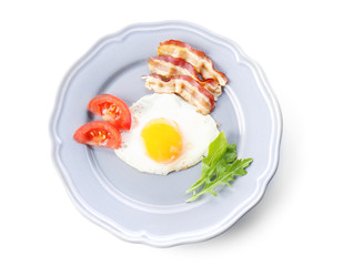 Plate with tasty egg for breakfast on white background