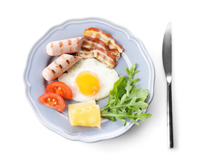 Plate with tasty egg for breakfast on white background