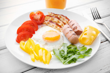 Tasty breakfast with egg on plate