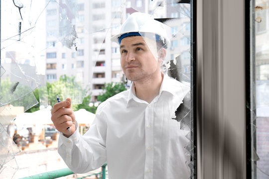 Insurance Adjuster Inspecting Abandoned Building