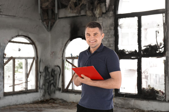 Insurance Adjuster Inspecting Abandoned Building