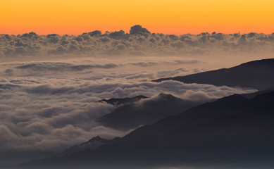 Game of Clouds after Sunset at the Coast of La Reunion, France