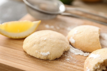Homemade cookies with lemon flavor on wooden board