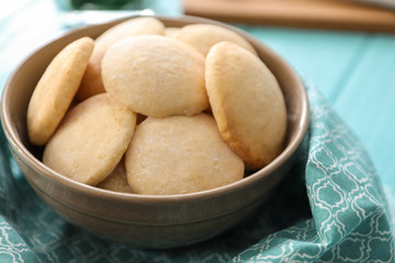 Bowl with homemade lemon cookies on table, closeup