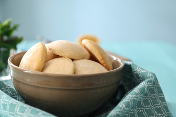 Bowl with homemade lemon cookies on table, closeup