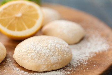 Fototapeta na wymiar Homemade cookies with lemon flavor on wooden board