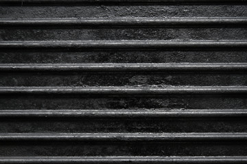 Ribbed cast iron textured surface, closeup