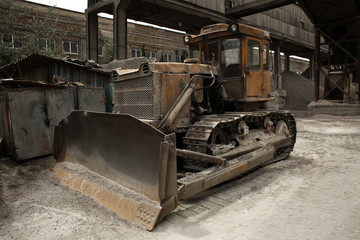 Fototapeta na wymiar Bulldozer on the territory of concrete batching plant
