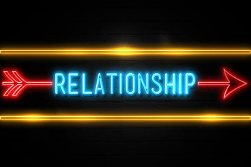 Relationship  - fluorescent Neon Sign on brickwall Front view