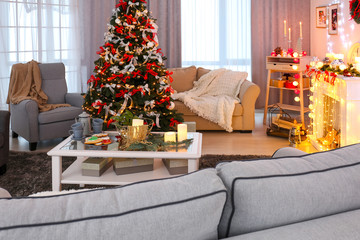 Decorated living room with beautiful Christmas tree