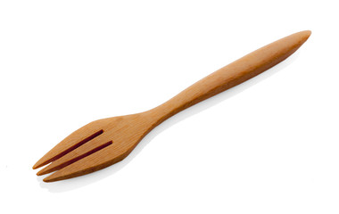Wooden fork on white background