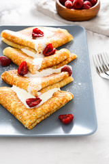 Pancakes with raspberries and cream.