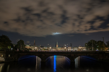 Fototapeta na wymiar nightly panorama of Hamburg - Inner City with full moon