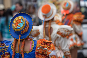 closeup details of colourful indigenous female costume and hat at Corpus Christi annual parade