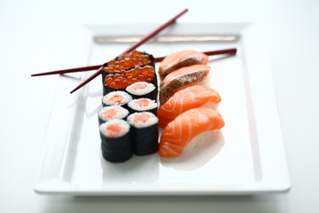 Set of sushi and rolls with a salmon