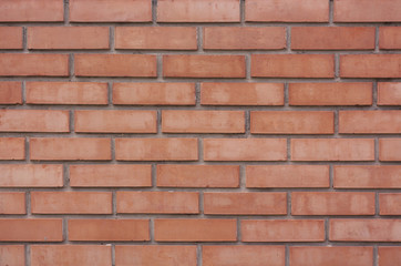 The brick wall is red