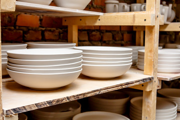 A pottery. A lot of different dishes that are ready for roasting.